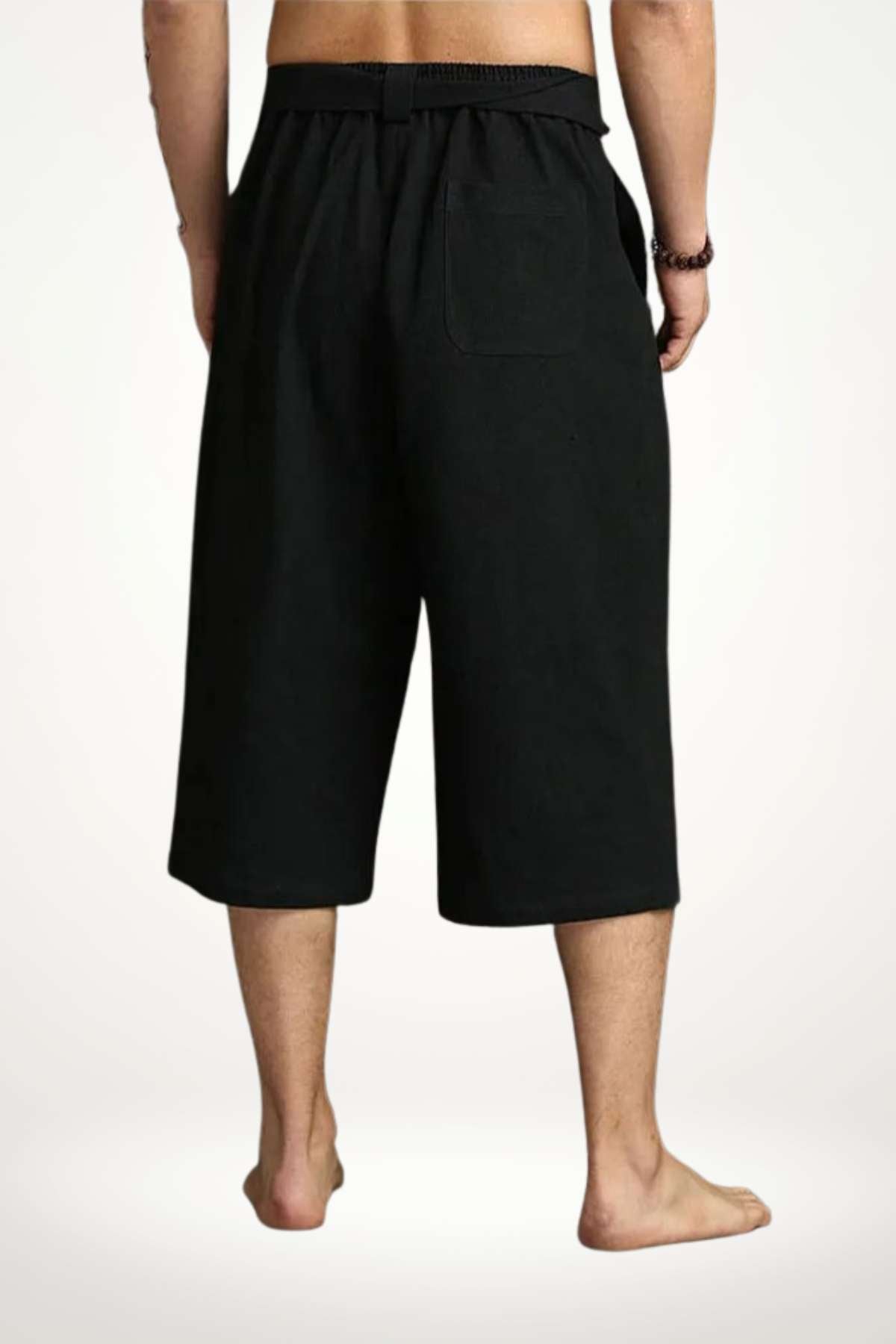 Pantalon kimono noir en tissu léger, avec une coupe ample et une taille élastique, vu de dos