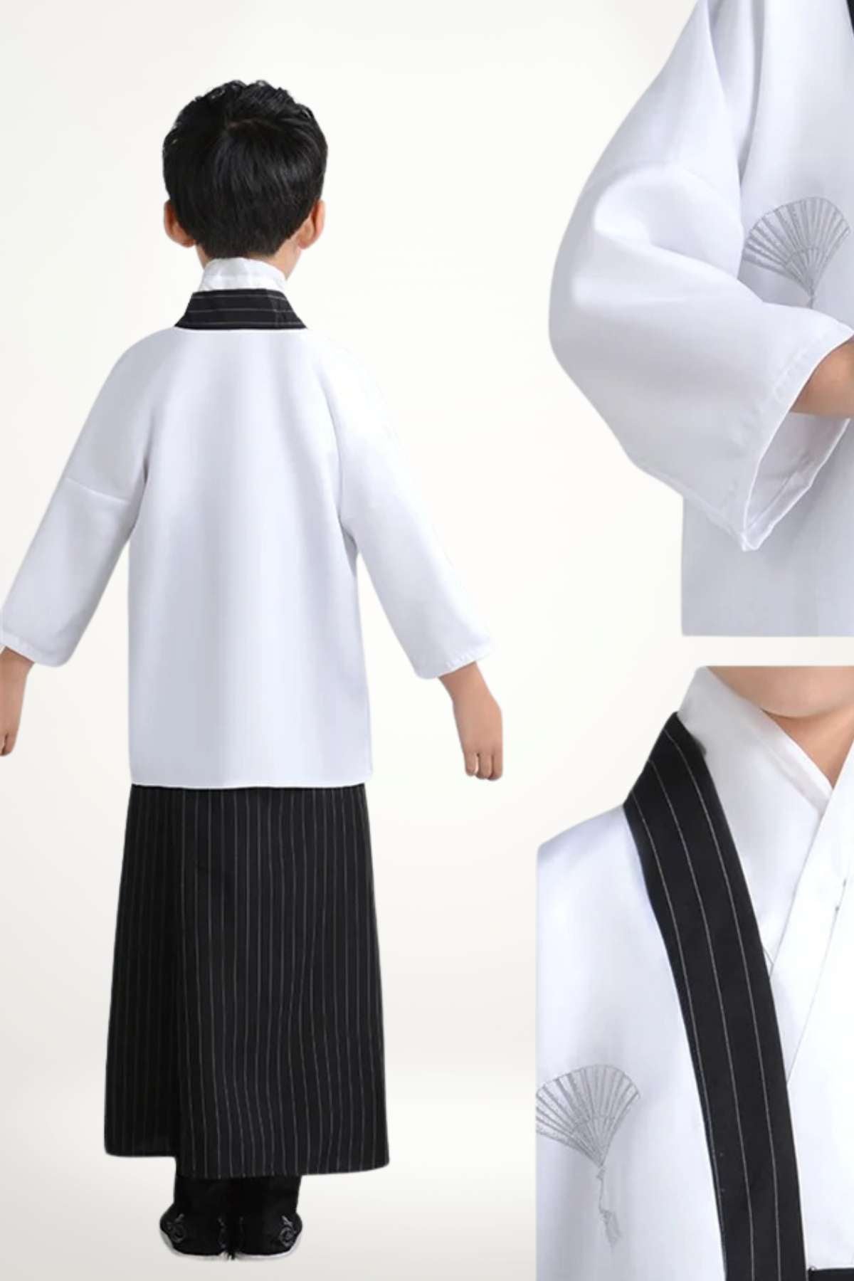 Kimono enfant blanc avec col noir et jupe à rayures verticales, présenté de dos sur fond clair