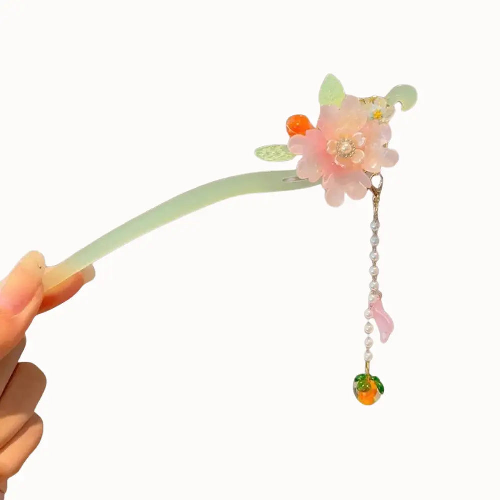 Peigne à cheveux à fleur rose pêche et perles de verre.