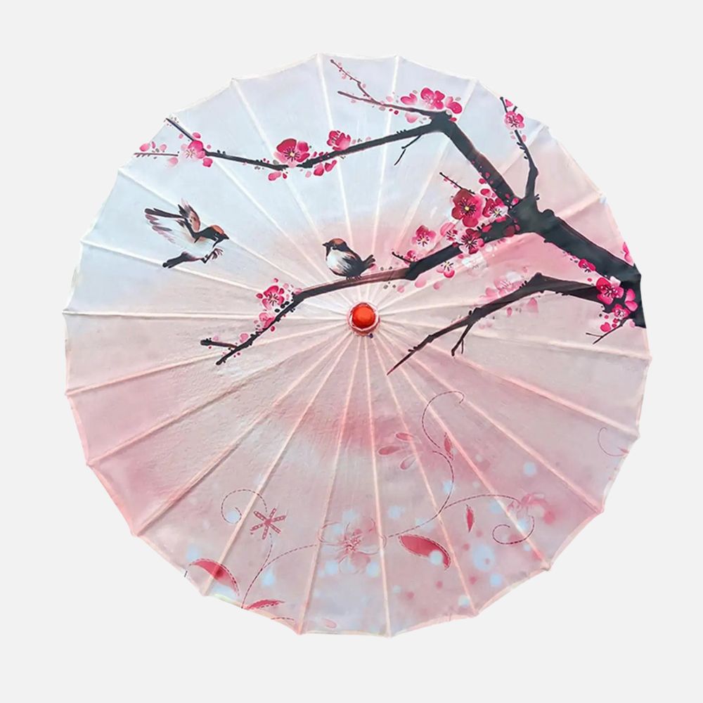 Ombrelle anti-UV rose ornée de fleurs et d'oiseaux, avec un motif délicat sur un fond pastel