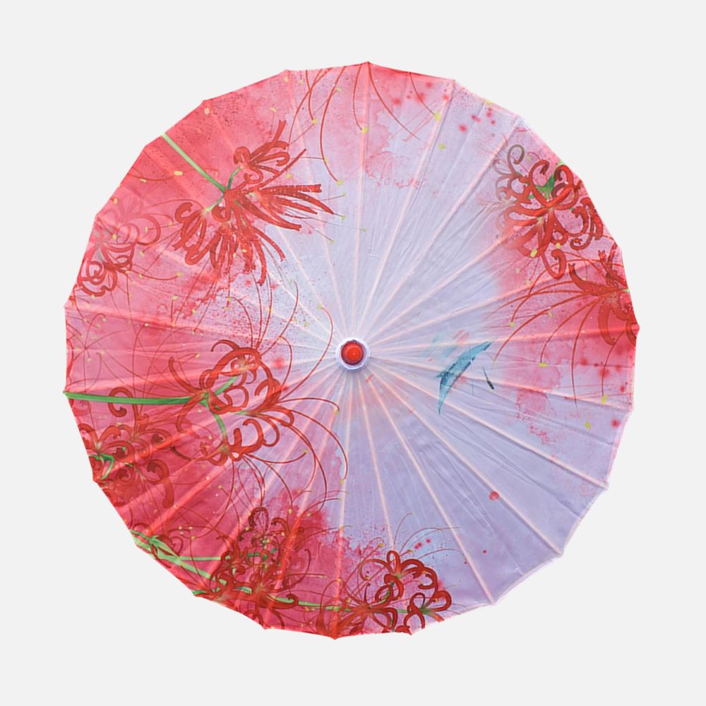 Ombrelle rose ornée de motifs floraux rouges, avec un design délicat et une texture légère en toile