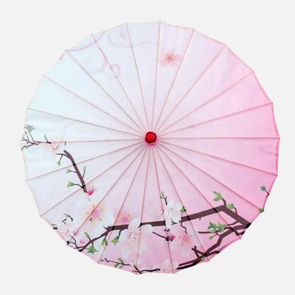 Ombrelle soleil pour femme de couleur rose, ornée de fleurs blanches et de branches sur un fond dégradé