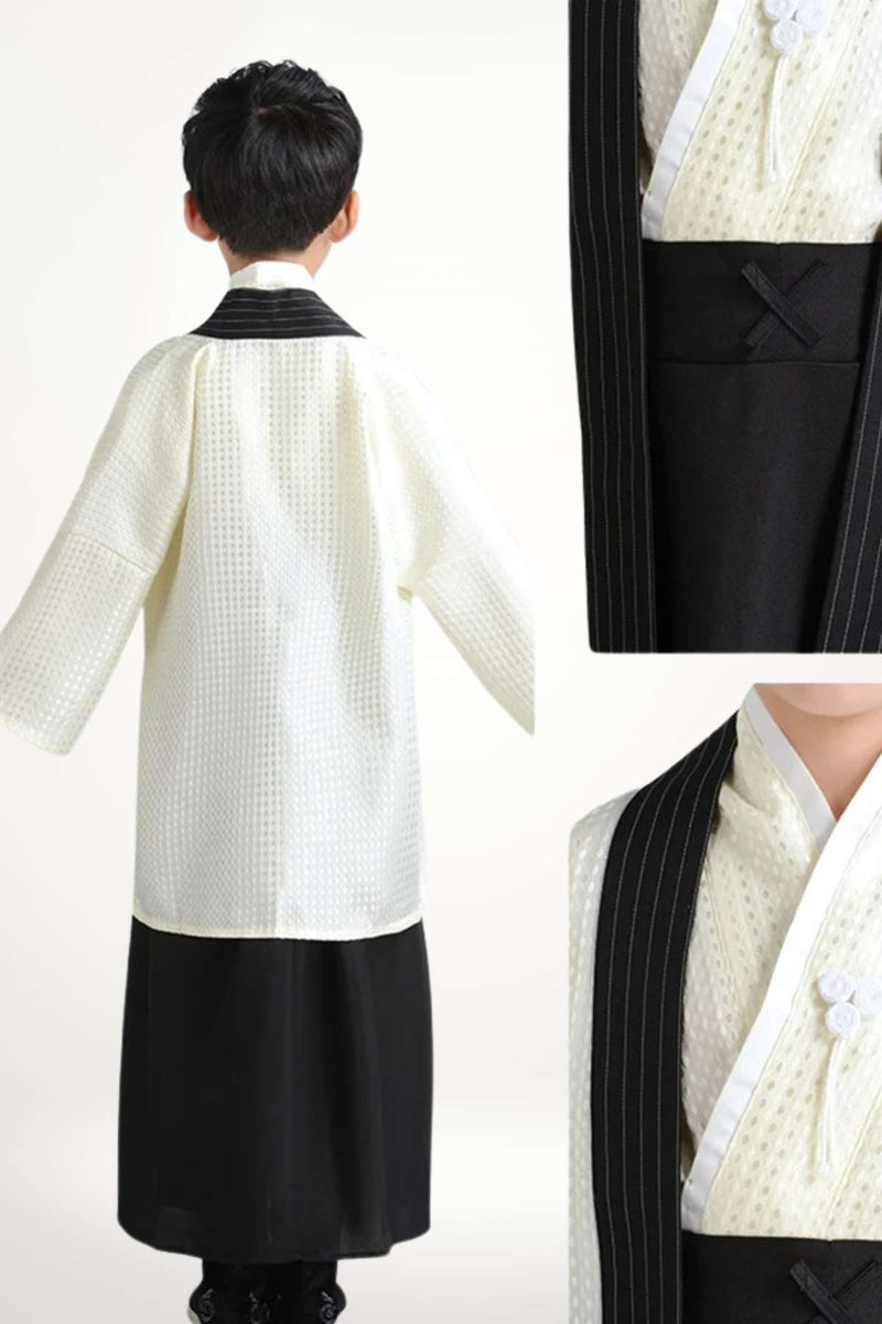 Kimono enfant en style japonais traditionnel, blanc à motifs texturés et jupe noire, présenté de dos