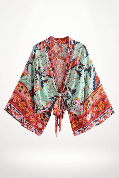Kimono court pour femme en tissu léger, avec motifs floraux colorés sur fond vert et bordure rose