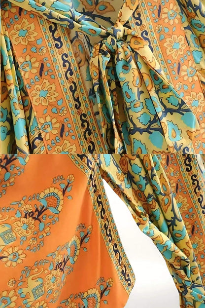 Un kimono léger et bohème aux motifs floraux orange et bleu, avec un lien à la taille et des manches