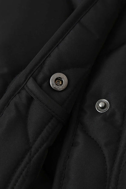 Veste kimono femme matelassée noire en polyester avec quilting circulaire, coupe droite et col rond.